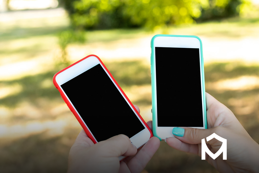 Two smartphones with blank screens